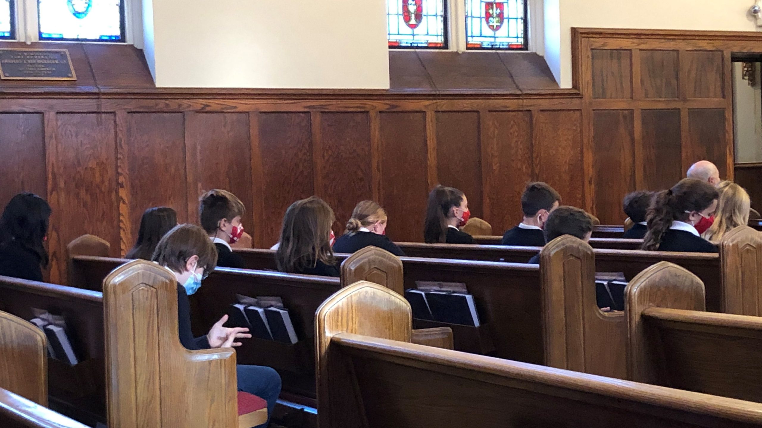 Children in church wearing masks